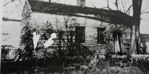 black and white photo of a former slave cabin